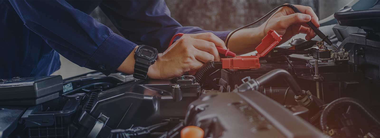 Auto Mechanic working on a car